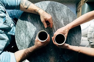 two-people-chatting-with-coffee